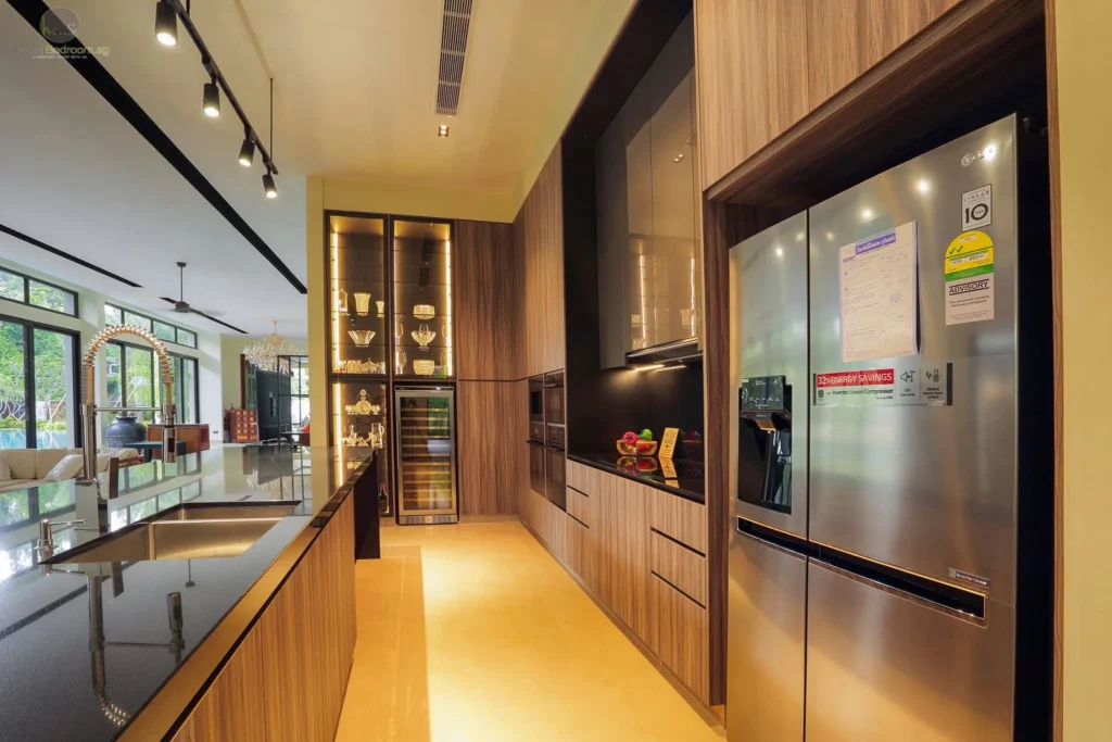 Sleek kitchen design with stainless steel appliances and wooden cabinets, reflecting a modern aesthetic in Singapore.