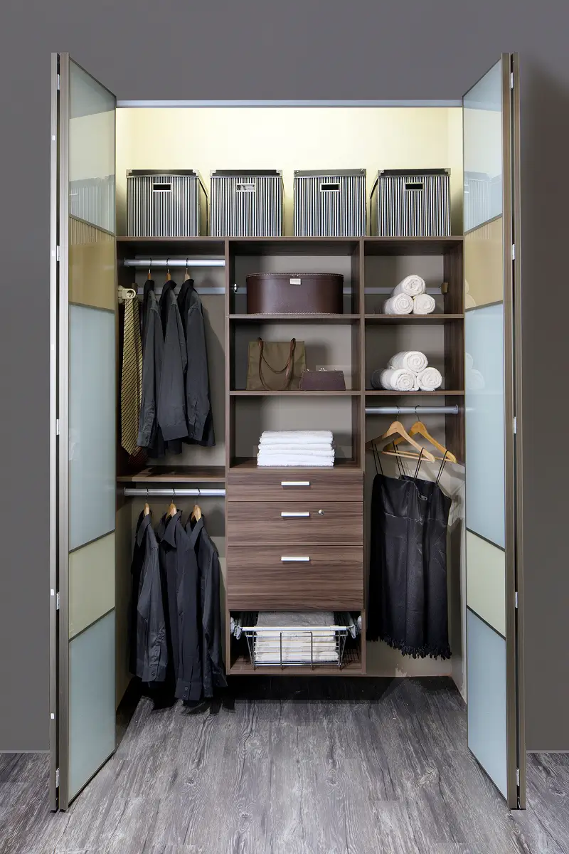 A closet featuring a wooden floor and a glass door, showcasing a stylish and affordable wardrobe option in Singapore.