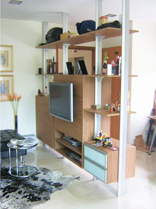 HausPole pole system open shelving as a TV cabinet wall