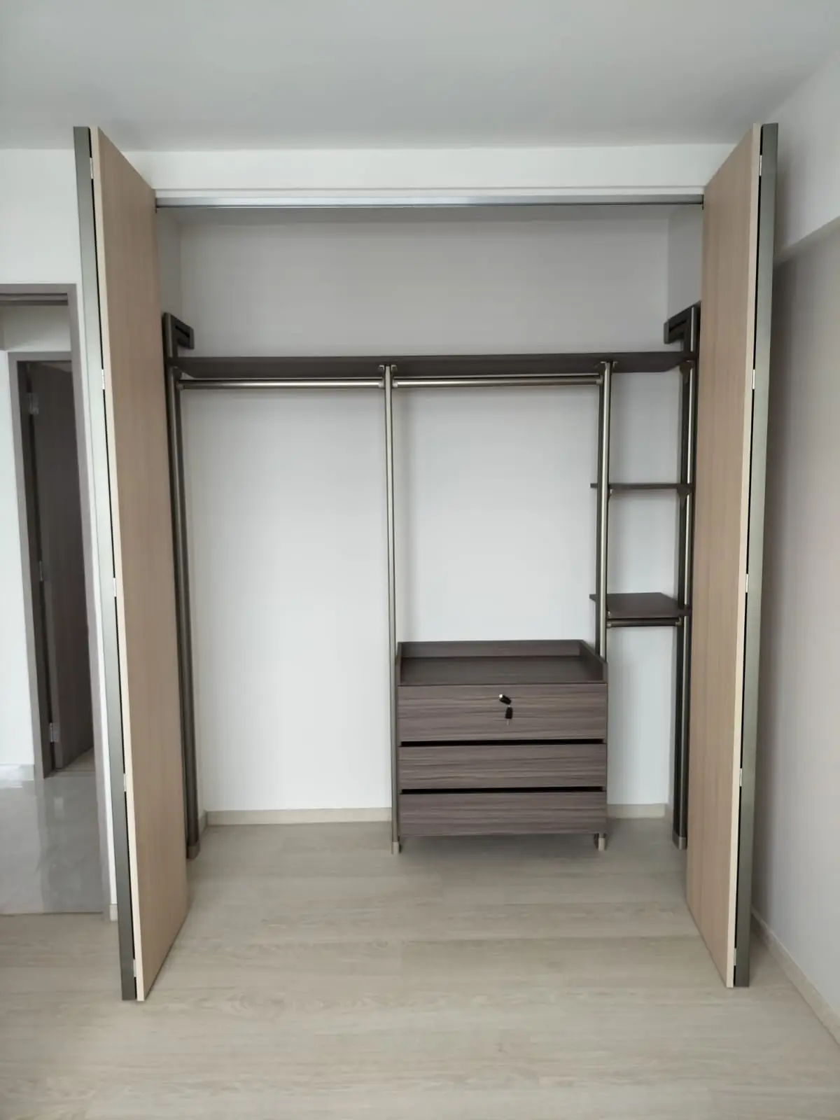 Pole system wardrobe in singapore condominium with internal shown