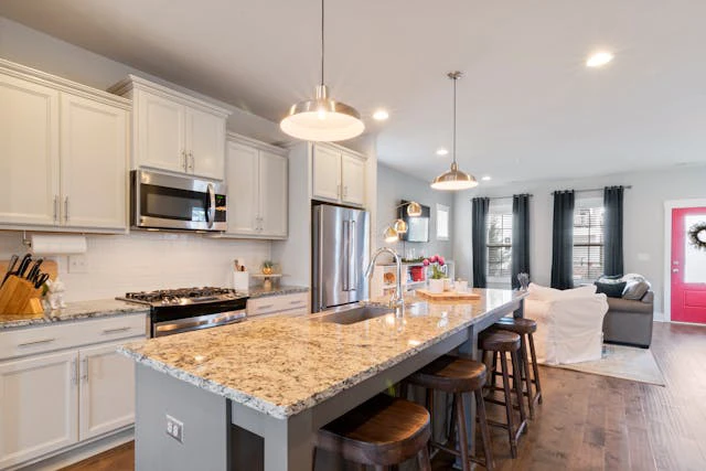 2025 Kitchen Cabinet Design Trends in Singapore: Smart Layouts, Modern Materials & Sustainable Solutions 5 Multi-use island with seating and power sockets