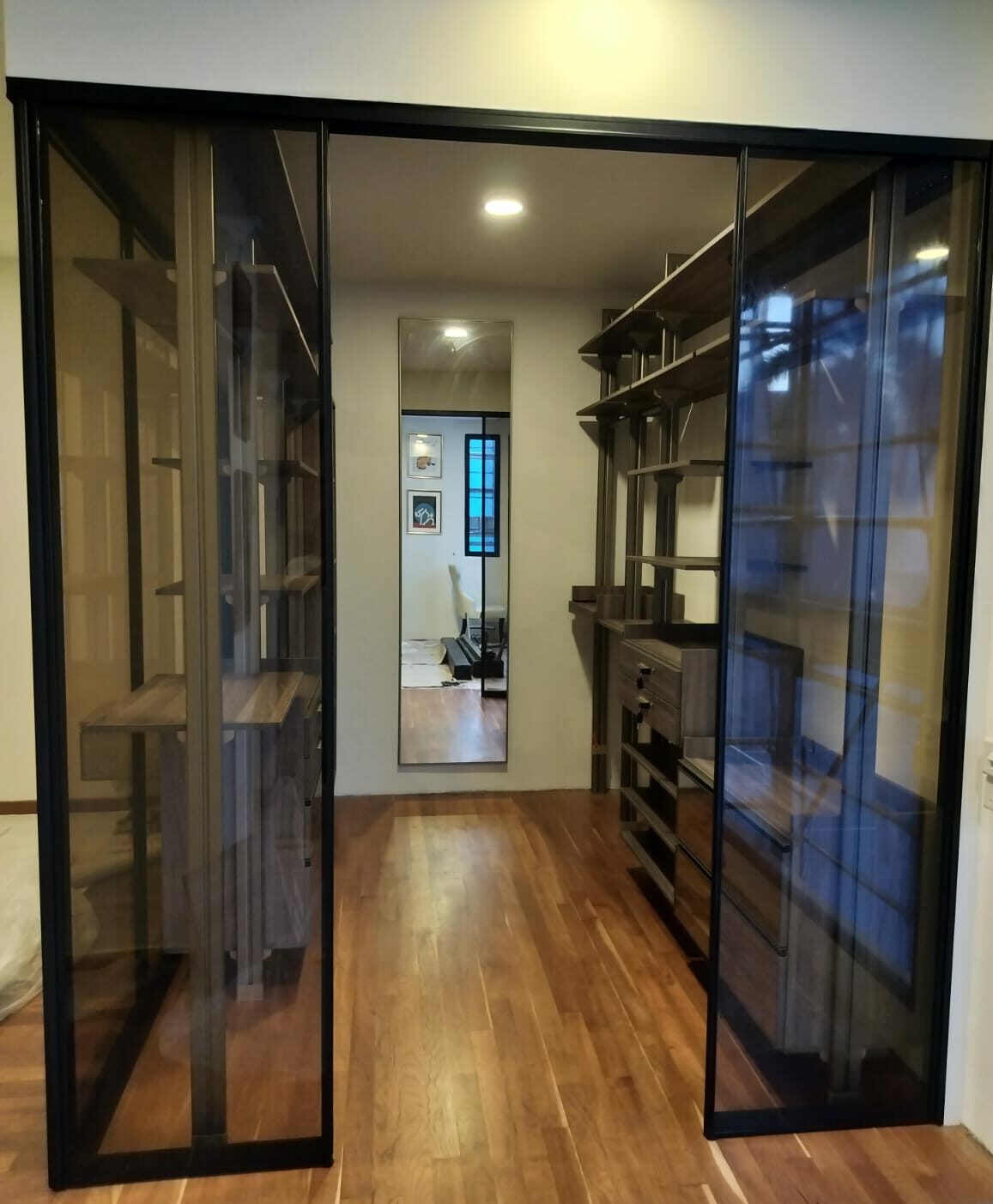HausPole pole system walk-in wardrobe on a partition wall