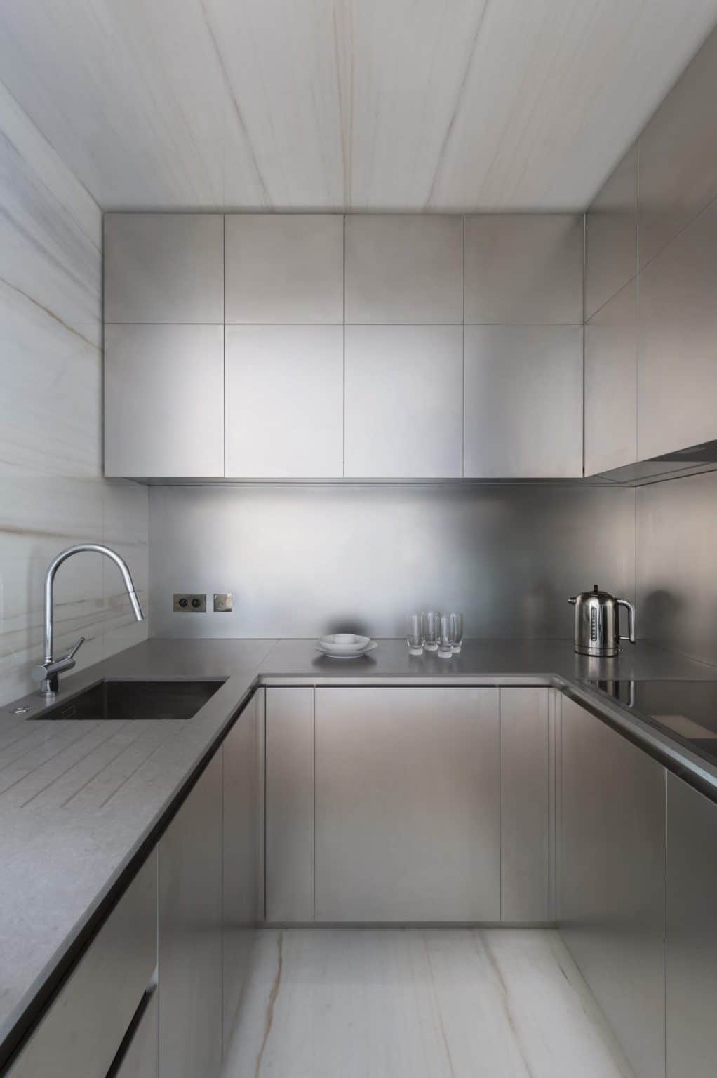 Stainless steel kitchen cabinet invoking industrial look