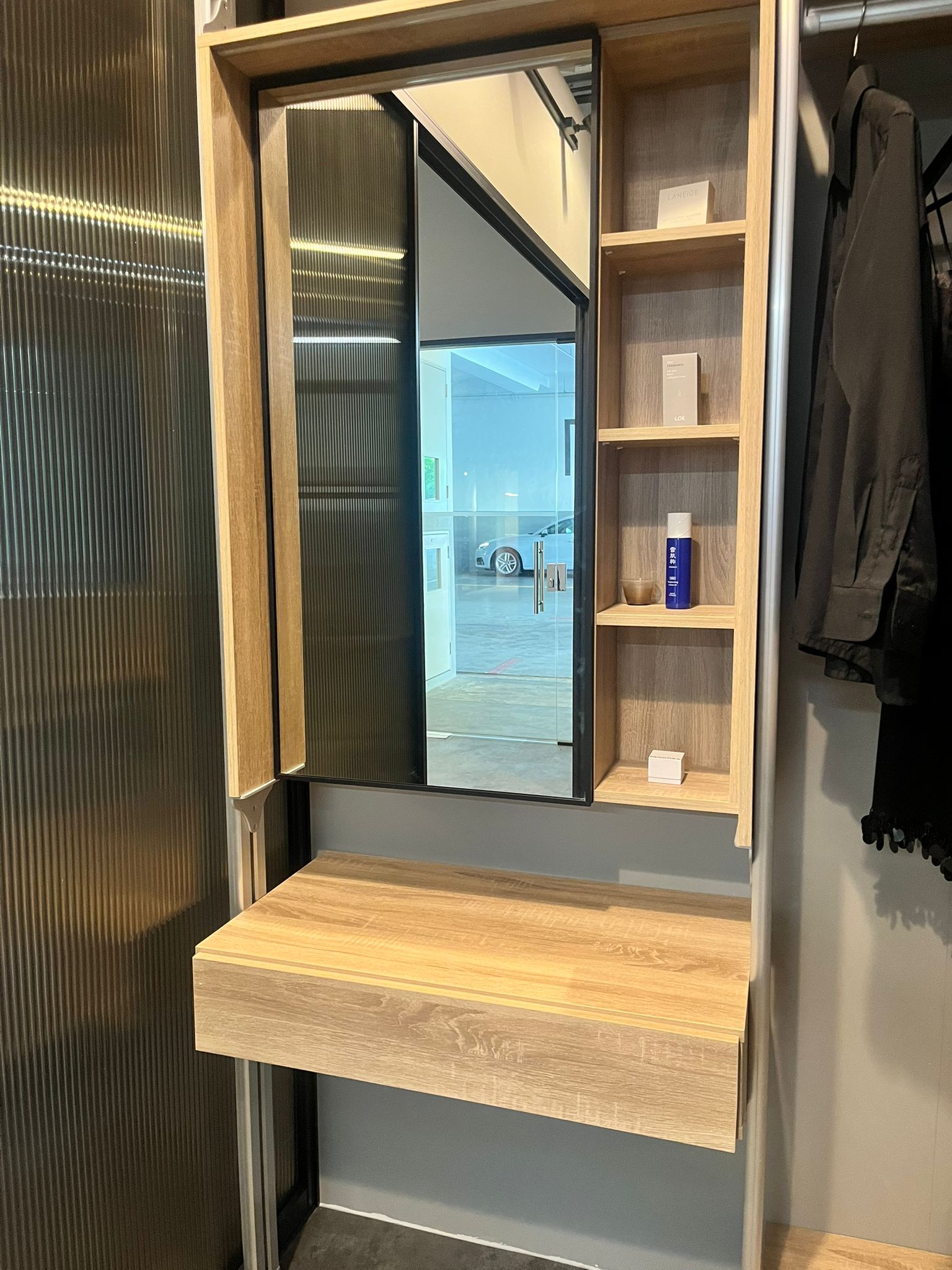 Open wardrobe with integrated dressing table in Singapore HDB room