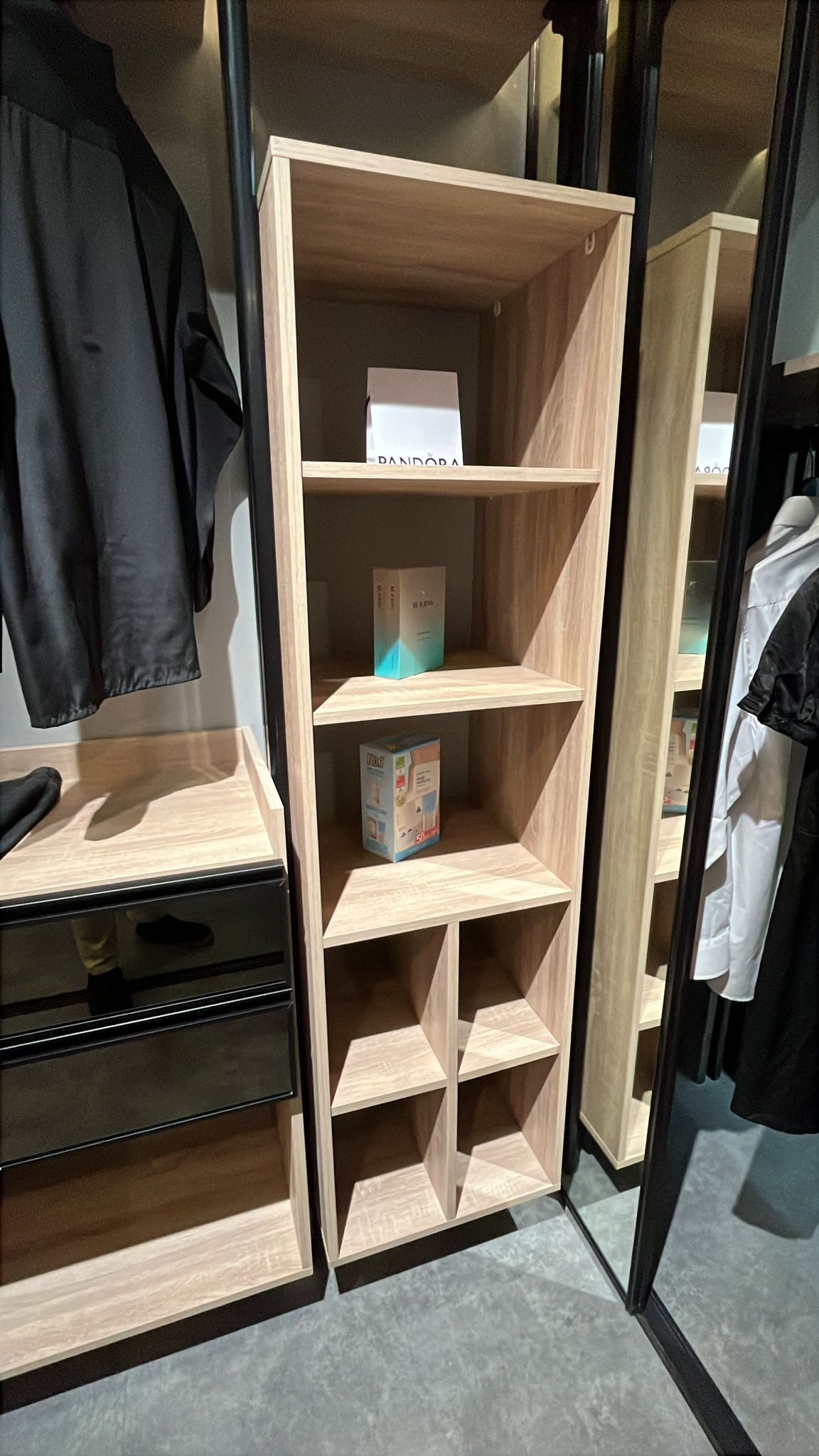 Pigeon-hole cubbies on an open pole system wardrobe