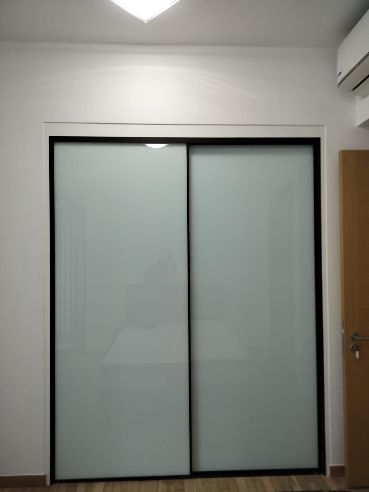 HausPole wardrobe with frosted glass sliding doors in Gambir Walk