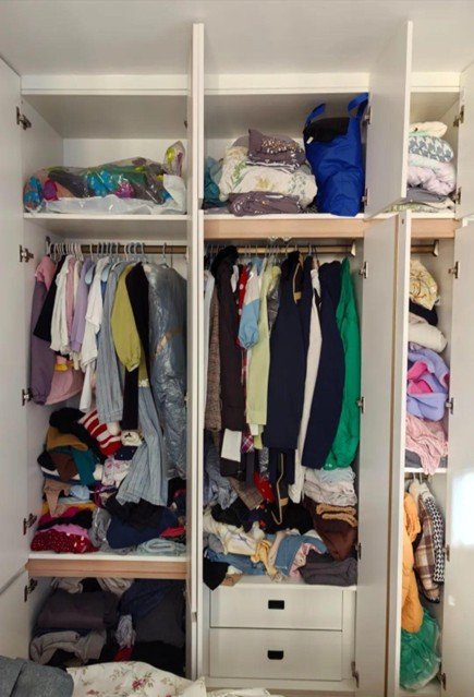 Full carpentry wardrobe with clutter