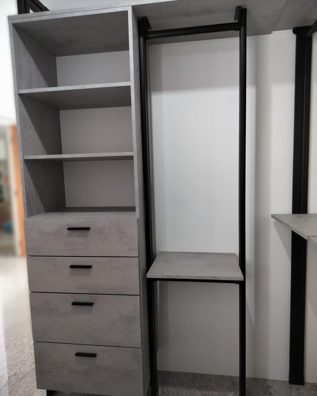 After: L-shaped HausPole black open concept wardrobe following slanted wall in Yishun HDB