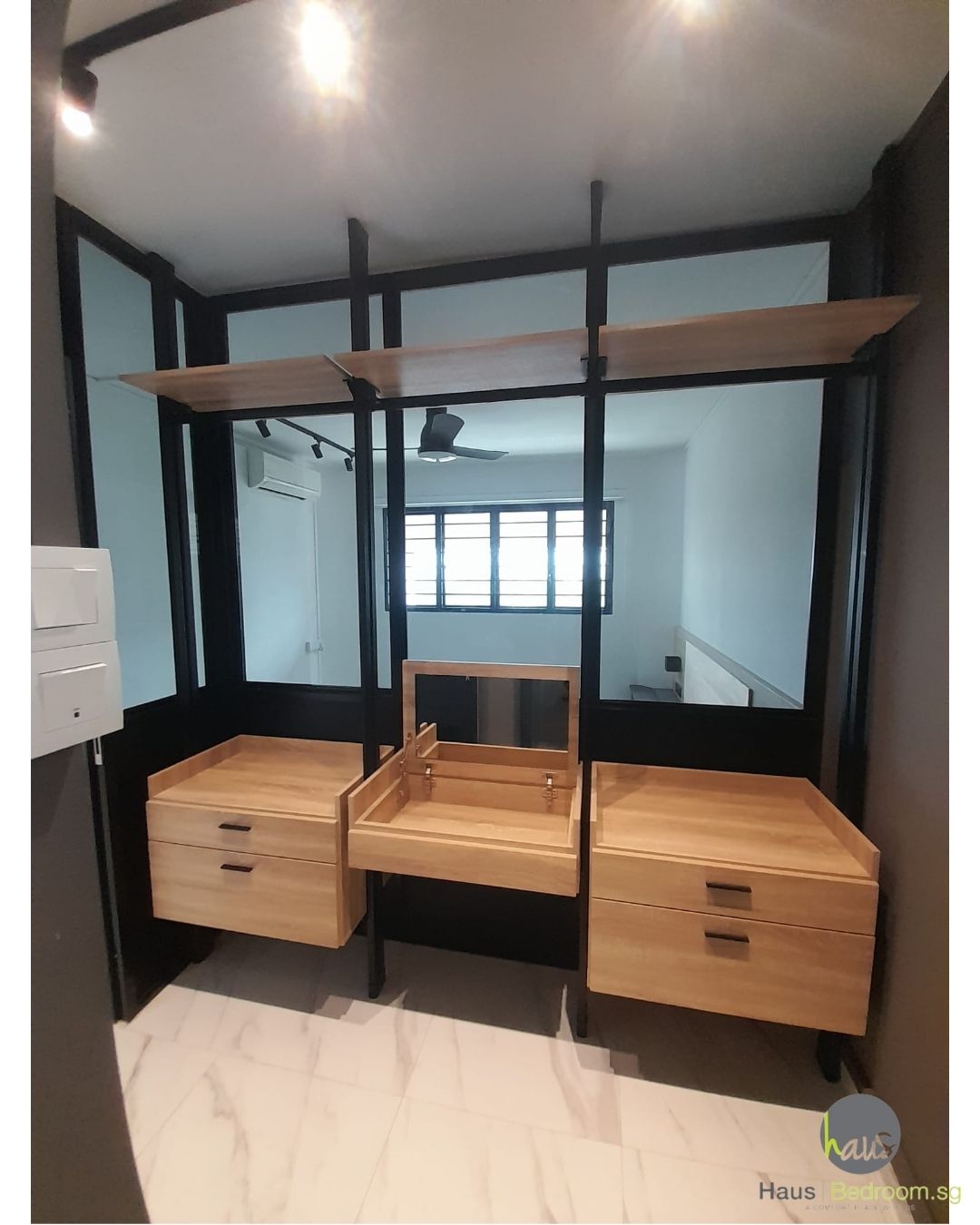 Black HausPole pole system wardrobe installed in a bedroom
