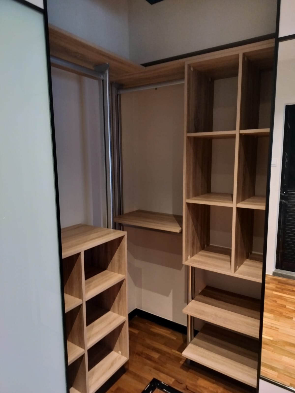 HausPole L-shaped pole system wardrobe fitted into a bedroom corner