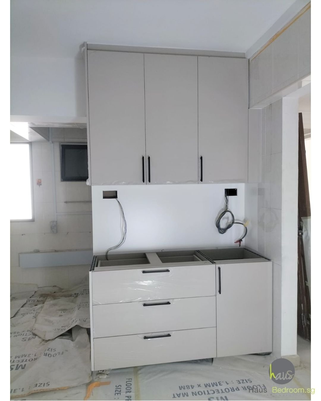 Full aluminium kitchen cabinets with laser-welded carcass and doors in a Choa Chu Kang HDB flat, before countertop installation