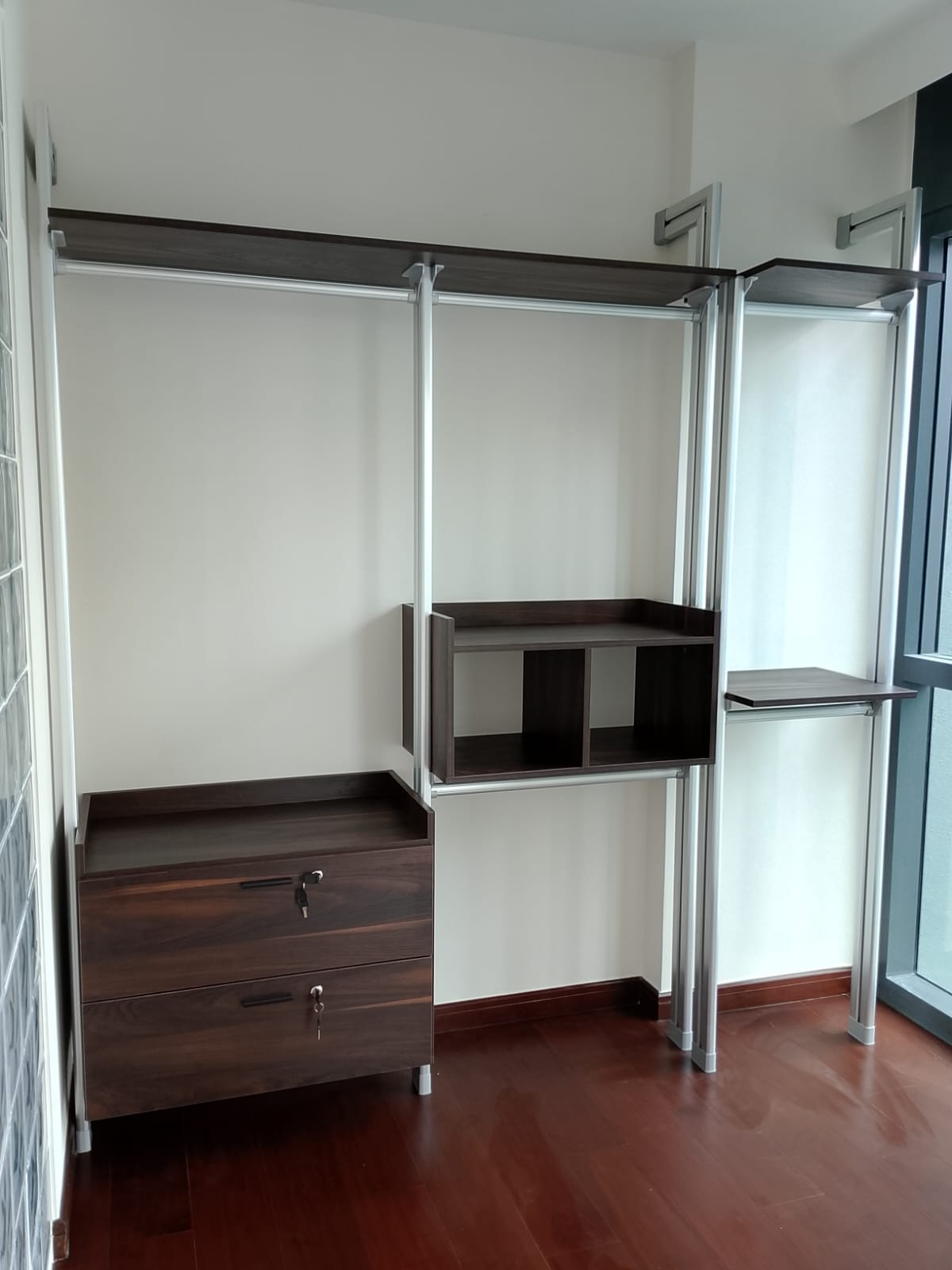 Silver HausPole pole system wardrobe installed in a bedroom